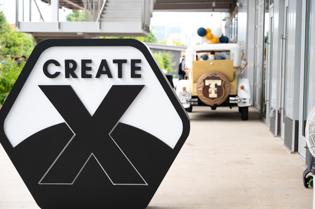 create-x mark with Georgia Tech car in background